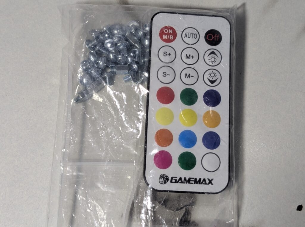 GameMax Leader 2 Review – A Bold, Spacious Case for Next-Gen Builds 5 GAMEMAX Leader 2 Case RGB Remote controller and screws and standoffs